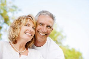 Middle-aged couple outside smiling